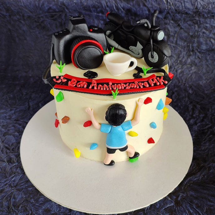 Adventure theme cake with bike and rock climbing
