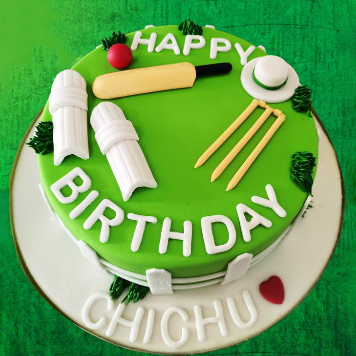 cricket theme cake with pads bat and ball