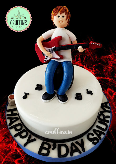custom guitar theme music cake with boy playing guitar