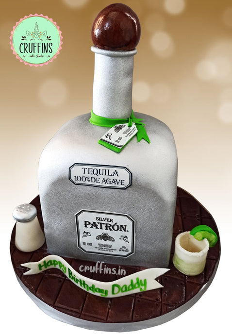 Patron tequila bottle with lime and lemon cake