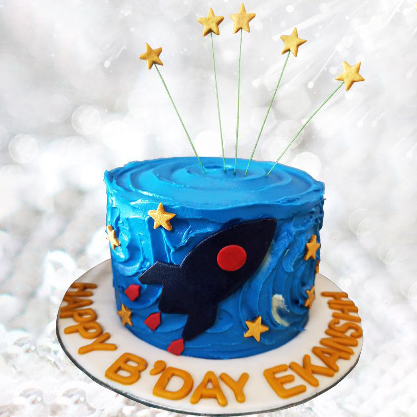 space rocket in the galaxy theme cake