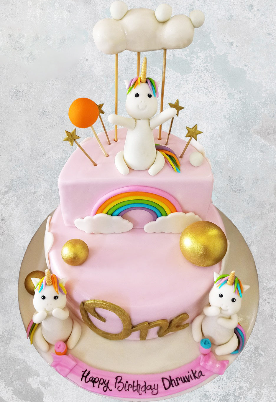 2 tier unicorn and clouds cake